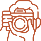 Illustration of person holding a camera