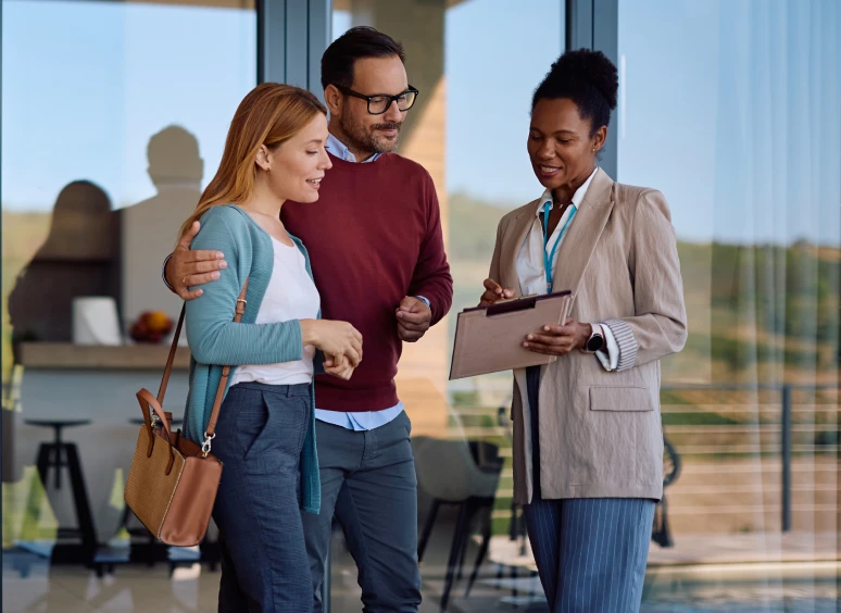 Couple consulting with real estate agent