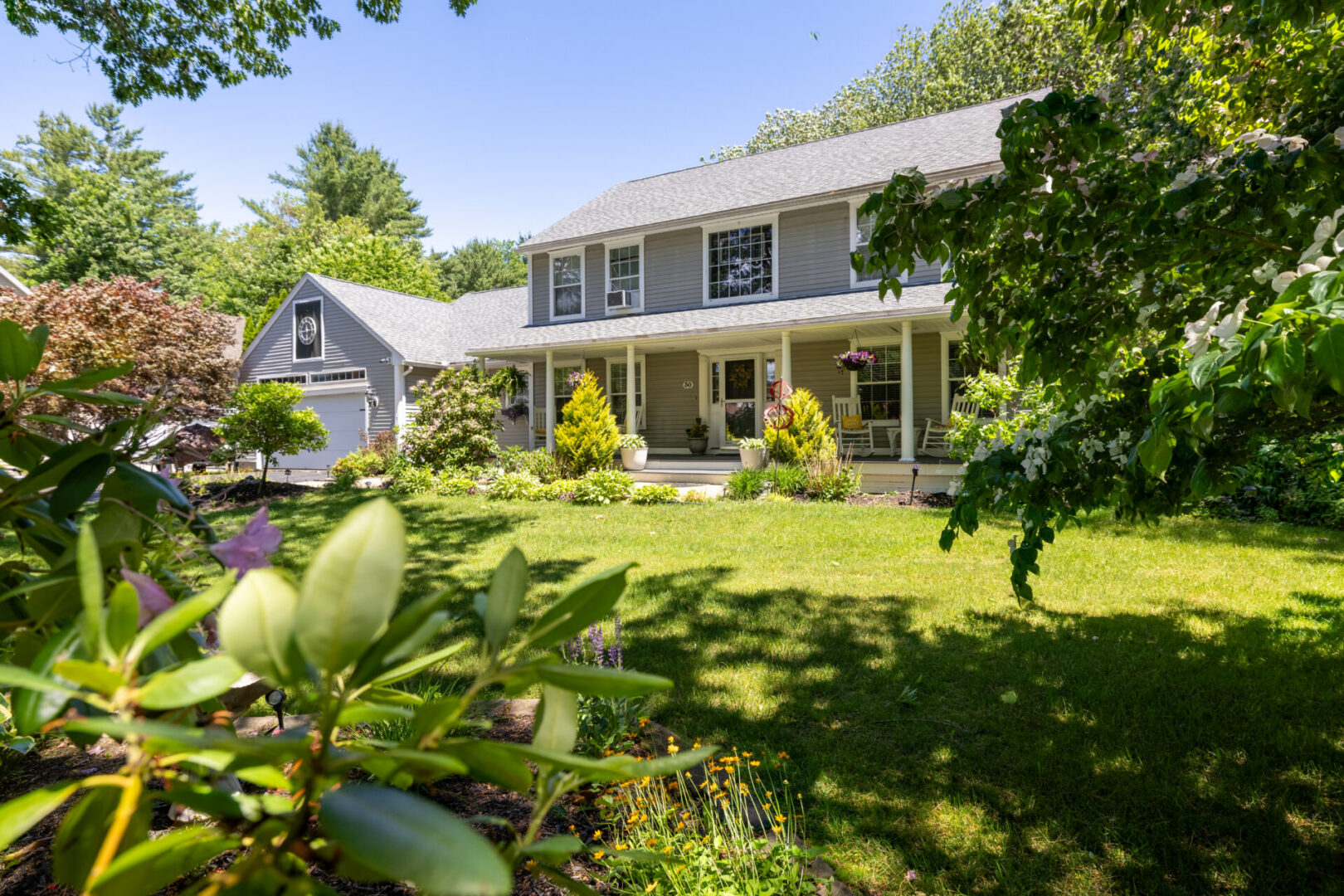 Suburban house with lush green garden.